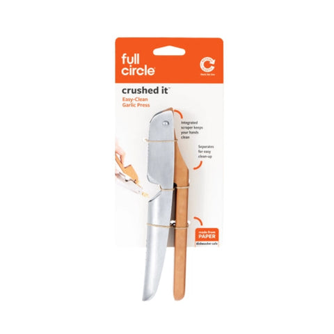 Garlic press with packaging on a white background